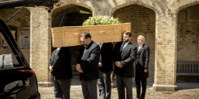 Coffin Being Carried At A Funeral